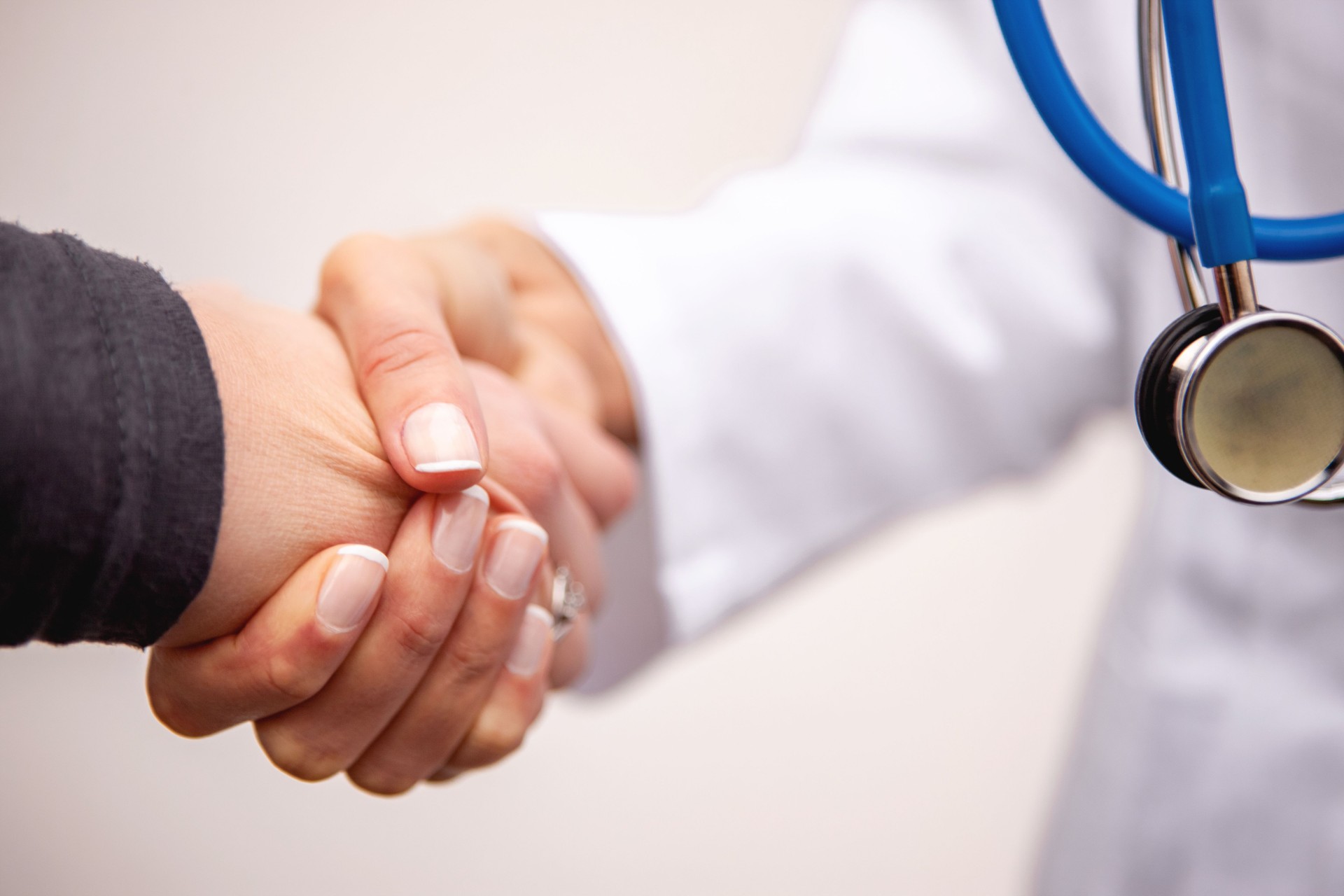 Doctor and patient shaking hands