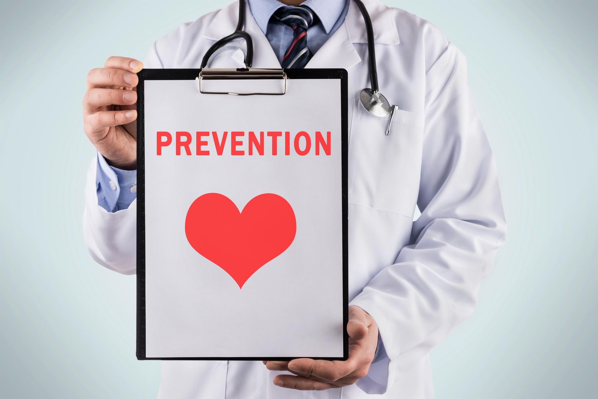 Doctor holding a clipboard with Prevention, Medical concept